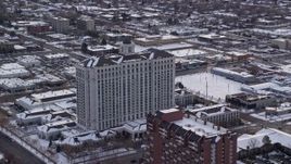 5.5K aerial stock footage orbit the Grand America Hotel in Downtown Salt Lake City with winter snow at sunrise, Utah Aerial Stock Footage | AX124_226
