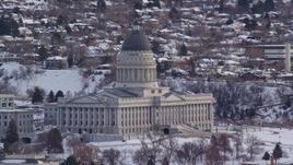 5.5K aerial stock footage orbit the Utah State Capitol with winter snow at sunrise, Salt Lake City Aerial Stock Footage | AX124_228E