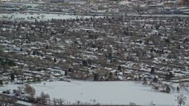5.5K aerial stock footage of snowy Salt Lake City suburban homes in winter, Utah Aerial Stock Footage | AX125_003