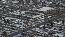 5.5K aerial stock footage of suburban Salt Lake City neighborhoods and shopping center with winter snow in Utah Aerial Stock Footage | AX125_004