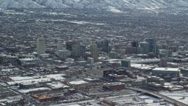 5.5K aerial stock footage of panning across Downtown Salt Lake City with winter snow, Utah Aerial Stock Footage | AX125_005