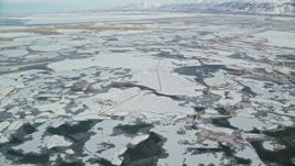5.5K aerial stock footage of frozen marshlands near Salt Lake City in wintery Utah Aerial Stock Footage | AX125_019