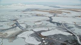 5.5K aerial stock footage of ice and snow in a frozen marshland near Salt Lake City, Utah Aerial Stock Footage | AX125_021