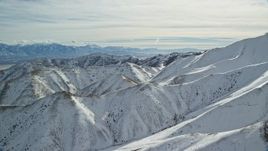 5.5K aerial stock footage of snow on steep ridges in the Oquirrh Mountains, Utah Aerial Stock Footage | AX125_122