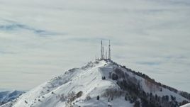5.5K aerial stock footage of radio towers on the frozen summit of Farnsworth Peak, Utah Aerial Stock Footage | AX125_129E