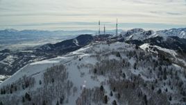 5.5K aerial stock footage of radio towers on Farnsworth Peak's summit with winter snow in Utah Aerial Stock Footage | AX125_133E