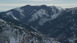 5.5K aerial stock footage of snowy mountain peak in the Oquirrh Mountains of Utah Aerial Stock Footage | AX125_175