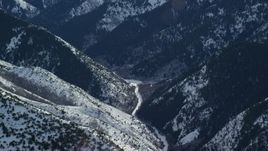5.5K aerial stock footage of clearing at the end of a snowy mountain road in the Oquirrh Mountains, Utah Aerial Stock Footage | AX125_176E