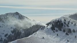 5.5K aerial stock footage of a long snowdrift plume in the Oquirrh Mountains, Utah Aerial Stock Footage | AX125_188E