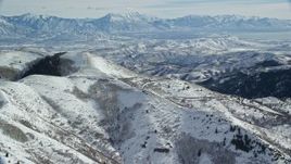 5.5K aerial stock footage of fresh snow on the Oquirrh Mountains in winter, Utah Aerial Stock Footage | AX125_225