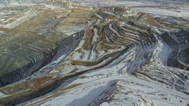 5.5K aerial stock footage pan to reveal the Bingham Canyon Mine with light winter snow in Utah Aerial Stock Footage | AX125_233E