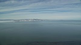 5.5K aerial stock footage pan across a wide view of the Great Salt Lake in wintertime, Utah Aerial Stock Footage | AX125_302E