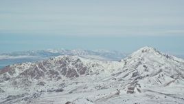 5.5K aerial stock footage of snowy peaks on Antelope Island in Utah Aerial Stock Footage | AX125_314