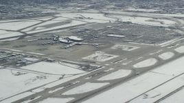 5.5K aerial stock footage approach commercial jet racing down runway at SLC Airport in winter, Utah Aerial Stock Footage | AX125_326