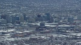 5.5K aerial stock footage of downtown buildings with winter snow in Downtown Salt Lake City, Utah Aerial Stock Footage | AX125_335