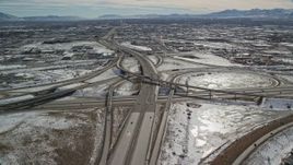 5.5K aerial stock footage of a freeway and nearby interchange in Salt Lake City in winter, Utah Aerial Stock Footage | AX126_003E