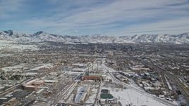 5.5K aerial stock footage approach power plant and Downtown Salt Lake City with winter snow, Utah Aerial Stock Footage | AX126_006
