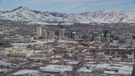 5.5K aerial stock footage of Downtown Salt Lake City with winter snow, Utah Aerial Stock Footage | AX126_009E