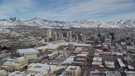 5.5K aerial stock footage of flying by Downtown Salt Lake City with snow on the ground in winter, Utah Aerial Stock Footage | AX126_011E