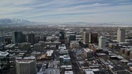 5.5K aerial stock footage orbit of buildings in the downtown area of Salt Lake City with winter snow, Utah Aerial Stock Footage | AX126_019E