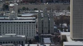 5.5K aerial stock footage orbit the Salt Lake Temple in downtown with winter snow, Utah Aerial Stock Footage | AX126_043