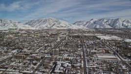 5.5K aerial stock footage orbit suburban neighborhoods by snowy mountains in winter, Salt Lake City, Utah Aerial Stock Footage | AX126_045