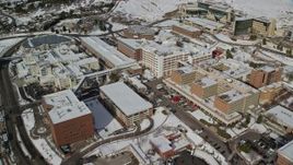 5.5K aerial stock footage orbit University of Utah hospital with winter snow, Salt Lake City Aerial Stock Footage | AX126_052