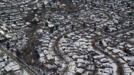 5.5K aerial stock footage orbit Salt Lake City suburban neighborhoods with winter snow, Utah Aerial Stock Footage | AX126_062E