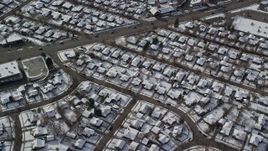 5.5K aerial stock footage of circling above a residential neighborhood in Salt Lake City with winter snow, Utah Aerial Stock Footage | AX126_065