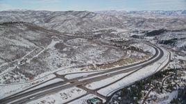 5.5K aerial stock footage approach Interstate 80 with light traffic through Park City, Utah Aerial Stock Footage | AX126_086E