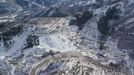 5.5K aerial stock footage of Utah Olympic Park with winter snow in Park City, Utah Aerial Stock Footage | AX126_095E