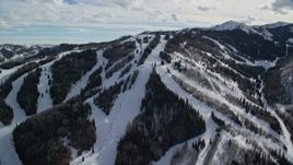 5.5K aerial stock footage orbit a ski lift and snowy runs at Park City Mountain Resort, Utah Aerial Stock Footage | AX126_124