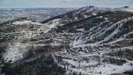 5.5K aerial stock footage approach the ski runs on snowy slopes at Deer Valley in Park City, Utah Aerial Stock Footage | AX126_129