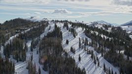 5.5K aerial stock footage orbit ski lifts and slopes at Deer Valley Ski Resort with winter snow, Utah Aerial Stock Footage | AX126_132