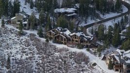5.5K aerial stock footage orbit Deer Valley mansion with winter snow in Utah Aerial Stock Footage | AX126_138