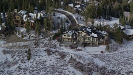 5.5K aerial stock footage of Deer Valley mansion with winter snow in Utah Aerial Stock Footage | AX126_139E