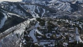 5.5K aerial stock footage of mountaintop Deer Valley mansions with winter snow in Utah Aerial Stock Footage | AX126_142E