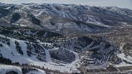 5.5K aerial stock footage of hilltop homes near the small town of Park City with winter snow, Utah Aerial Stock Footage | AX126_146E