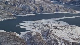 5.5K aerial stock footage of roads near the shore of Jordanelle Reservoir in winter, Heber City, Utah Aerial Stock Footage | AX126_179E