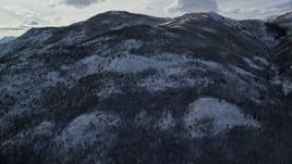 5.5K aerial stock footage pan and approach snowy Wasatch Range mountain slopes in winter, Utah Aerial Stock Footage | AX126_186E