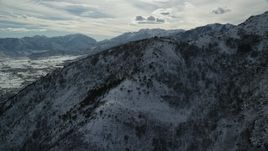 5.5K aerial stock footage approach top of frozen Wasatch Range mountain in winter, Utah Aerial Stock Footage | AX126_197
