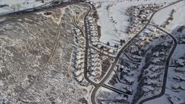 5.5K aerial stock footage orbit tract homes with snow in the shadow of a peak in Midway, Utah Aerial Stock Footage | AX126_204E