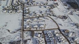 5.5K aerial stock footage fly over small residential neighborhood with snowy rooftops in winter, Midway, Utah Aerial Stock Footage | AX126_207