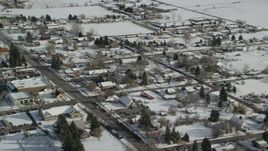 5.5K aerial stock footage of flying over snowy small town neighborhoods in winter, Midway, Utah Aerial Stock Footage | AX126_210