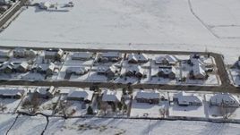 5.5K aerial stock footage orbit rows of tract homes with winter snow on rooftops in Midway, Utah Aerial Stock Footage | AX126_211