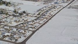 5.5K aerial stock footage orbiting rows of tract homes with winter snow in Midway, Utah Aerial Stock Footage | AX126_212