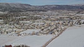 5.5K aerial stock footage orbit homes with winter snow on the outskirts of Heber City, Utah Aerial Stock Footage | AX126_215