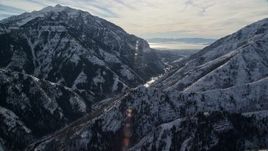 5.5K aerial stock footage approach Provo Canyon through snowy Wasatch Range in wintertime, Utah Aerial Stock Footage | AX126_240E