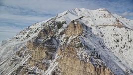 5.5K aerial stock footage orbit steep slopes of snowy Mount Timpanogos in winter, Utah Aerial Stock Footage | AX126_254