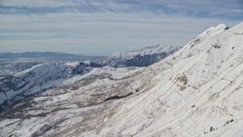 5.5K aerial stock footage fly over frozen Mount Timpanogos slopes in wintertime, Utah Aerial Stock Footage | AX126_263E
